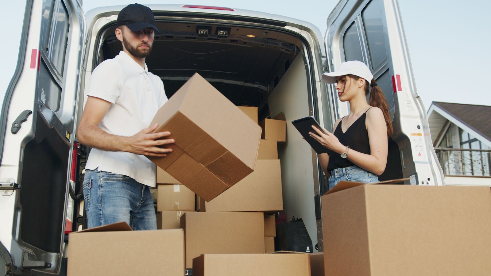 Nyati Movers loading boxes into a van for a move to Kitengela