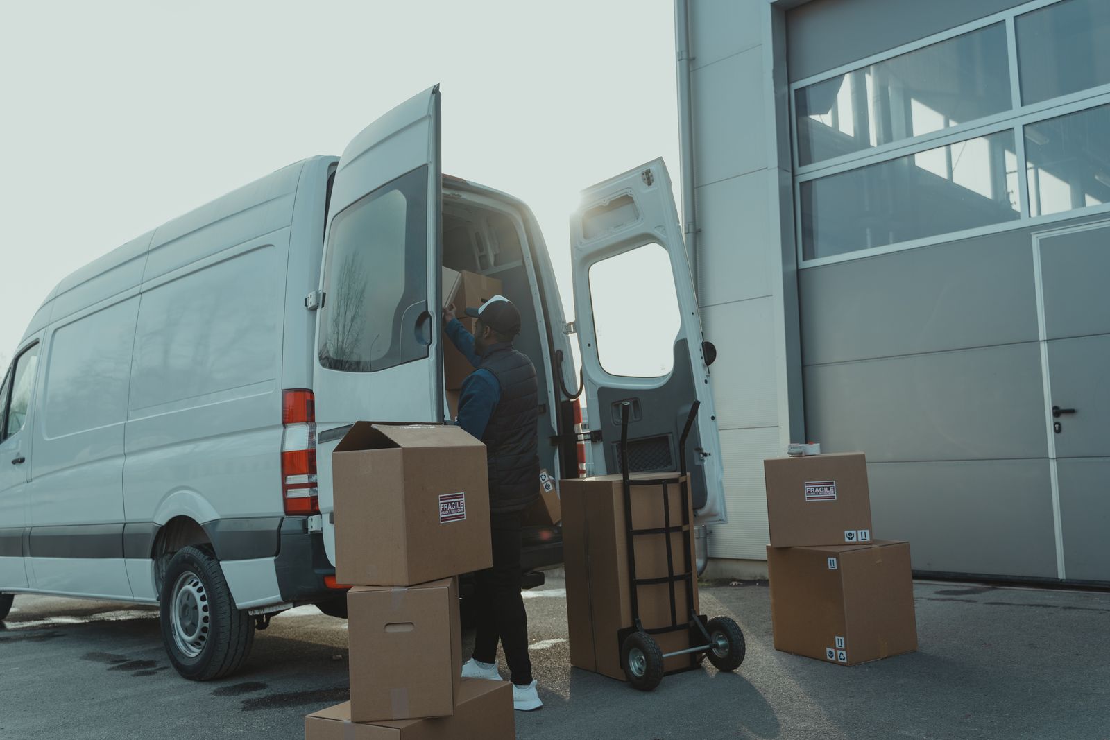 Boxes and a hand trolley at the back of a Nyati Movers van